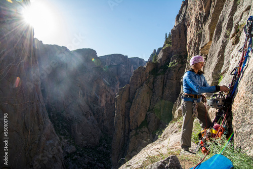 A woman rock climbing in the Black Canyon of the Gunnison, Montrose, Colorado.