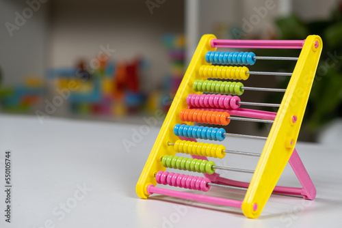 Colorful children s abacus on the table. Mathematics  arithmetic for preschool and school children  learning to count