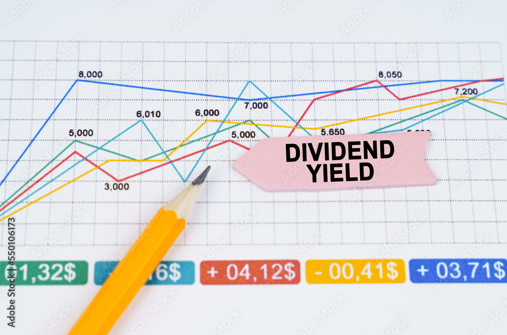 On business charts there is a pencil and an arrow sticker with the inscription - DIVIDEND YIELD