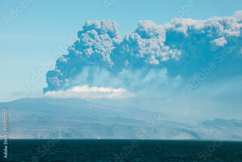 Viewed from Heimaey Island, the ash plume continues to erupt from Eyjafjallajokull Volcano near Skogar, Iceland. photo