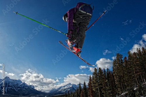 A skier flies high above the ski run at Lake Louise Ski Resort, Canada photo