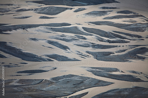 Ariel view of braided river flowing through valley in the Wrangell-St. Elias National Park, Alaska. photo