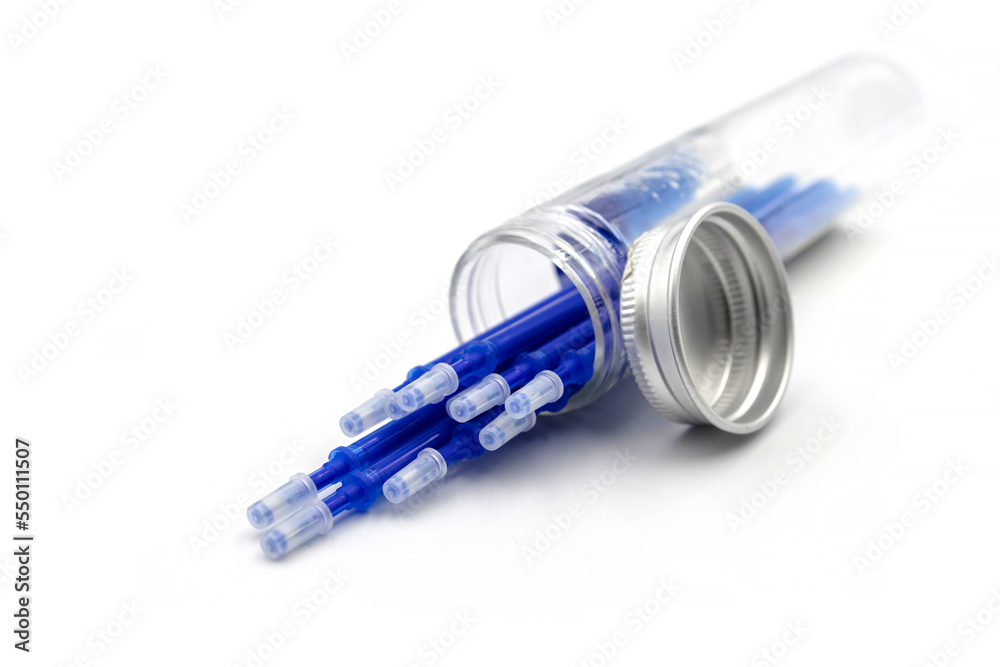 Refilling gel pens isolated on white background. Blue rods for pens in a flask. Gel pen ink. Stationery Refilling gel pens isolated on white background. Blue rods for pens in a flask. Gel pen ink. Stationery