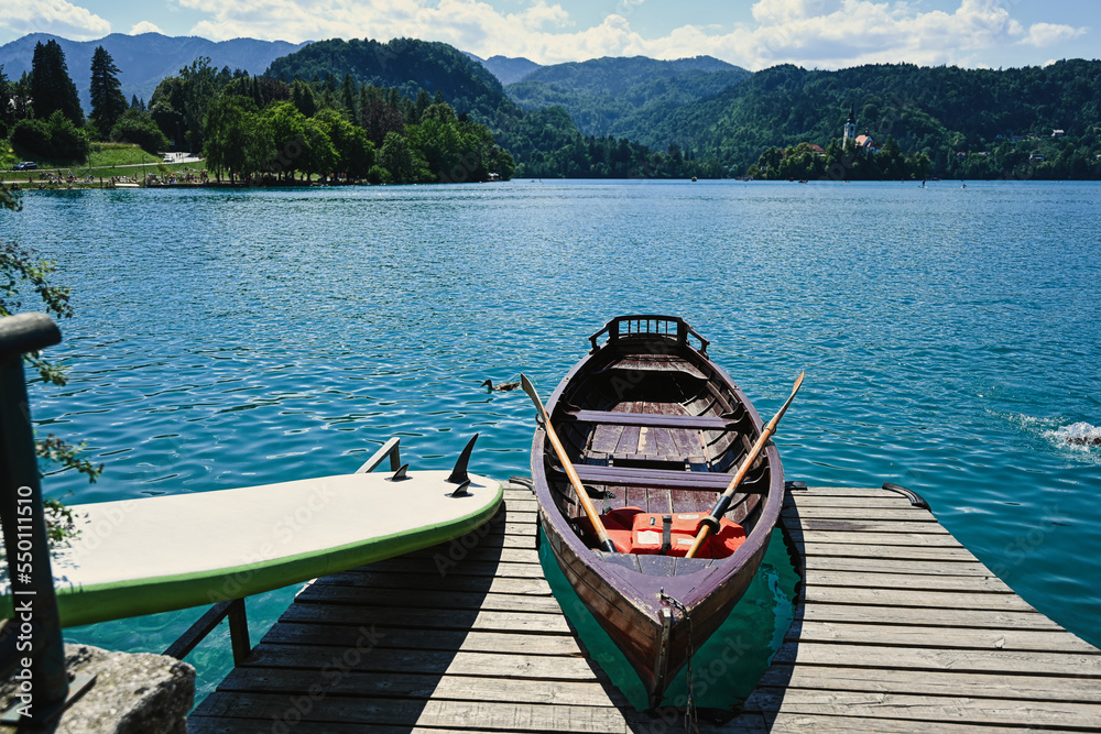 Wooden boat in pier of beautiful Bled Lake, Slovenia.