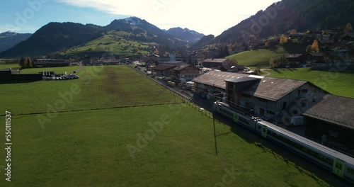 Train arriving in Zweisimmen - Aerial 4K photo