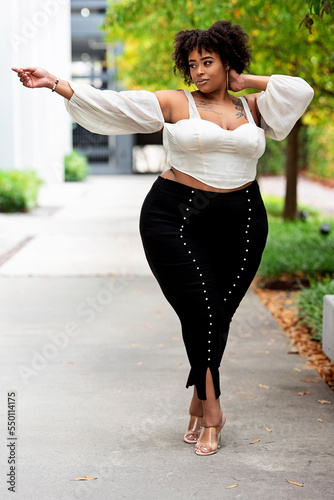 Plus size fashion forward Black woman outside 