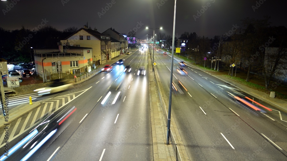 Cars move on the night highway. 