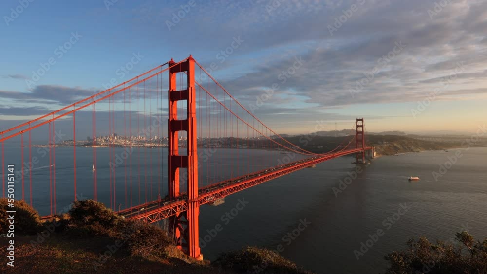 Timelapse of charming city panorama of San Francisco, CA, USA. Busy traffic along Golden Gate Bridge with hilly landscape below cloudy, sunset skyline. High quality 4k footage Timelapse of charming city panorama of San Francisco, CA, USA. Busy traffic along Golden Gate Bridge with hilly landscape below cloudy, sunset skyline. High quality 4k footage