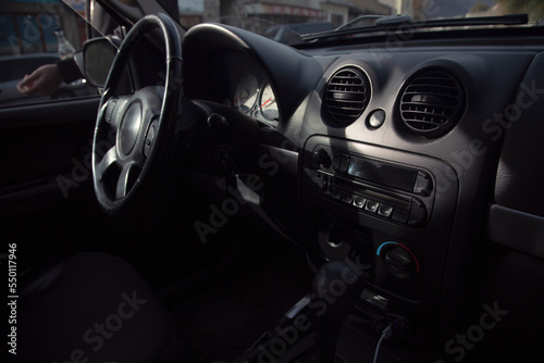 Black steering wheel in luxury car © Vahagn