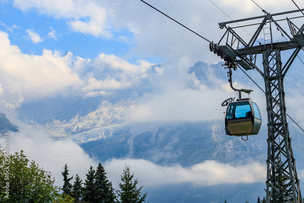 Overhead cable car to First mountain, Grindelwald, Switzerland Overhead cable car to First mountain, Grindelwald, Switzerland