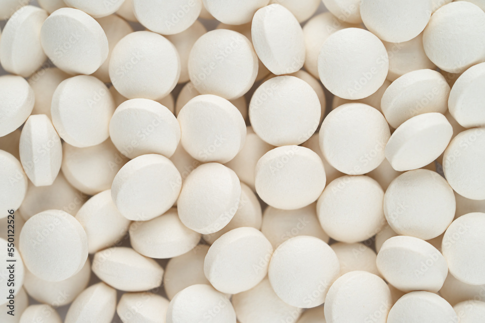 White round pills texture. Top view White round pills texture. Top view