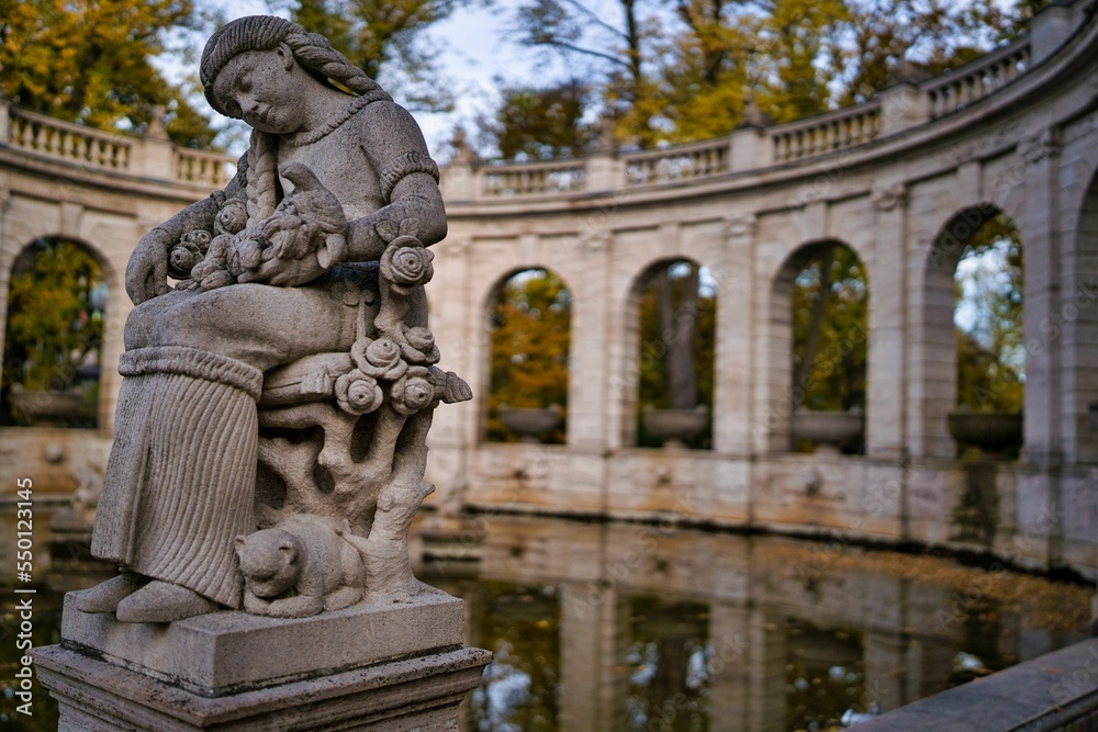 Fototapeta premium Figurine by the fairy tale fountain in the Volkspark Friedrichshain, in Berlin Germany