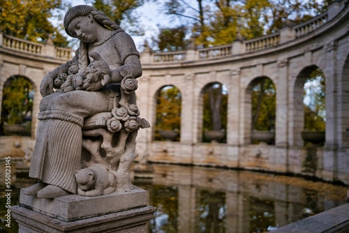 Figurine by the fairy tale fountain in the Volkspark Friedrichshain, in Berlin Germany