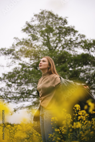 Girl in a yellow field in summer