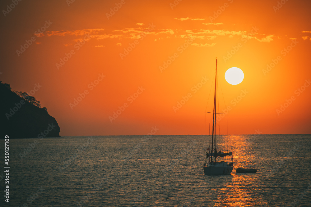 Sunrise above sea and pine tree with blue sea background Turkey Sunrise above sea and pine tree with blue sea background Turkey