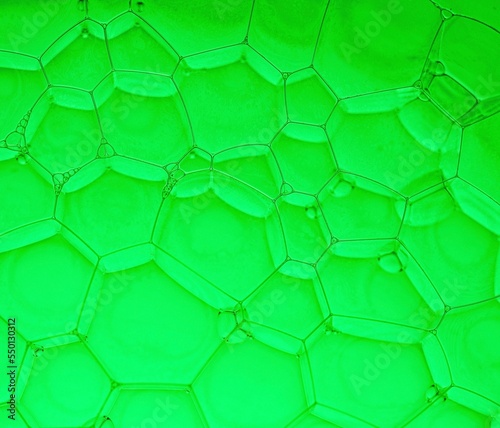 Pattern of hexagons. Close-up of bubbles in water with green background, Abstract backgrounds