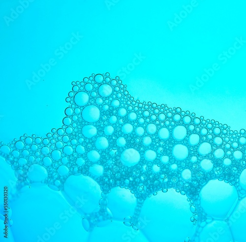 Close-up of bubbles in water with blue background, Abstract backgrounds
