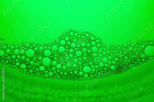 Close-up of bubbles in water with green background, Abstract backgrounds