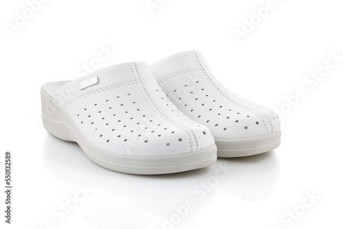 White professional ventilated work clogs. White hospital clogs. isolated on white background. Close-up.