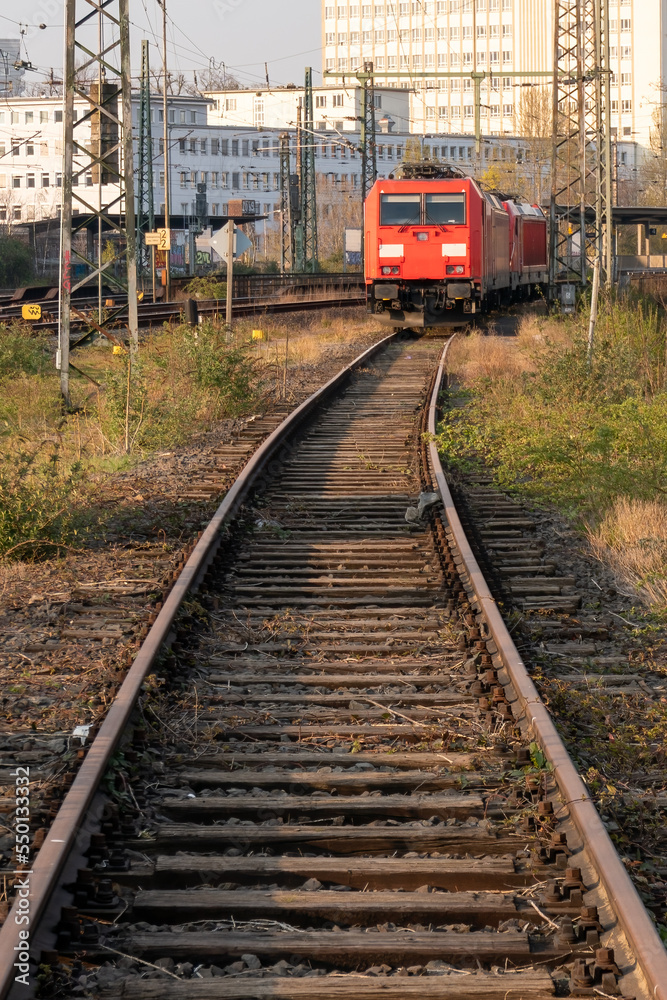 train tracks and front view of a locomotive in the city train tracks and front view of a locomotive in the city