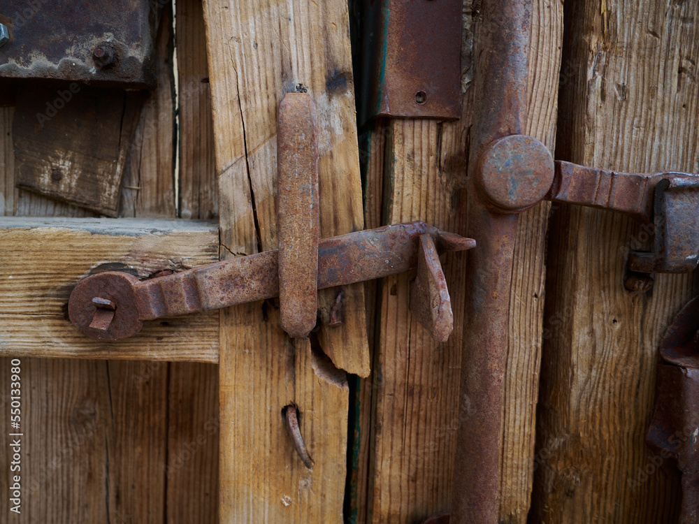 Old, picturesque main front door in mediterranean region house