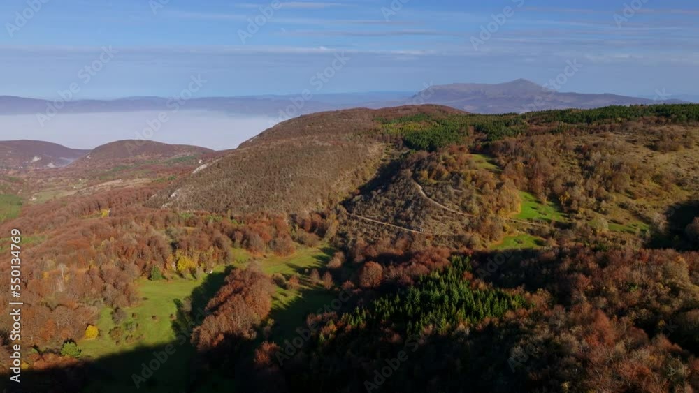 Aerial view on a beautiful autumn landscape with forest and small mountains. Aerial view on a beautiful autumn landscape with forest and small mountains.