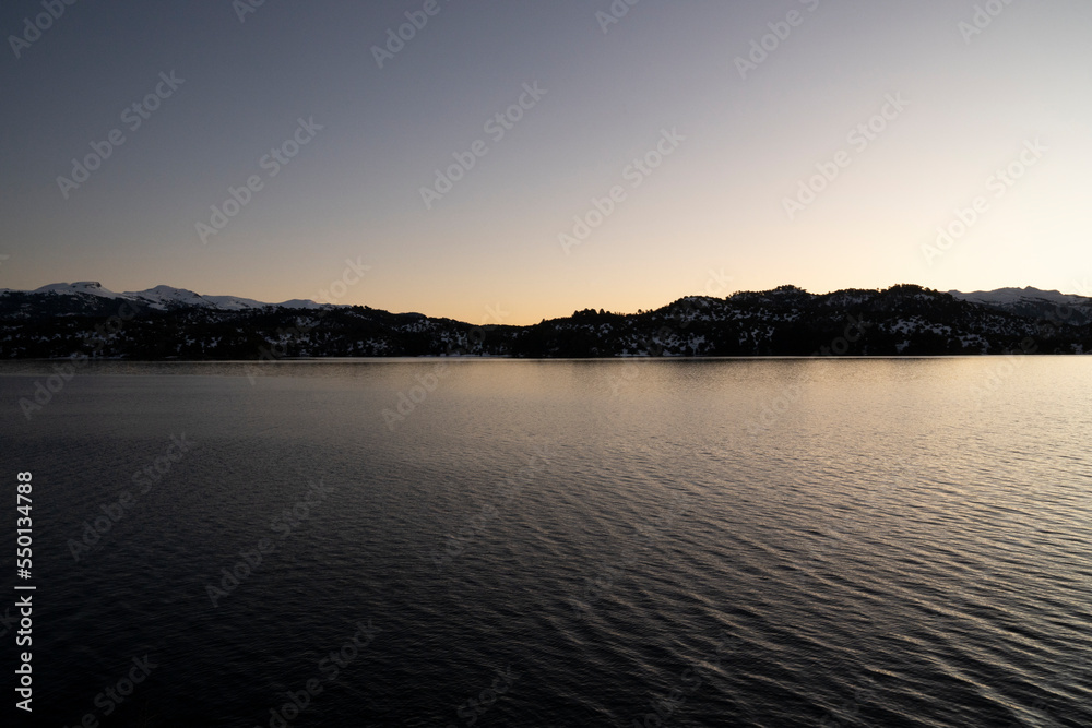 The lake and mountains at nightfall.	
