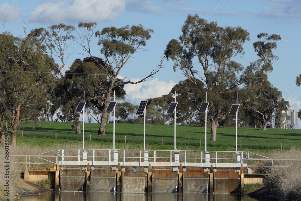 Remote, automatic Irrigation flow regulator weir on a channel Remote, automatic Irrigation flow regulator weir on a channel