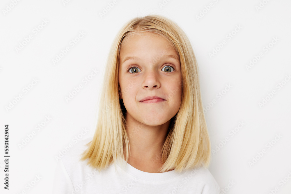 happy child with blond hair on a light background happy child with blond hair on a light background