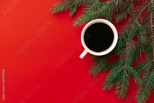 cup of coffee on red holidays background. Christmas mood background