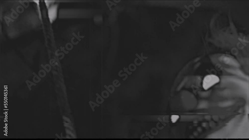 VINTAGE-LOOKING FOOTAGE OF A CREEPY MECHANICAL CLOWN ON A SWING.  FULL HD.