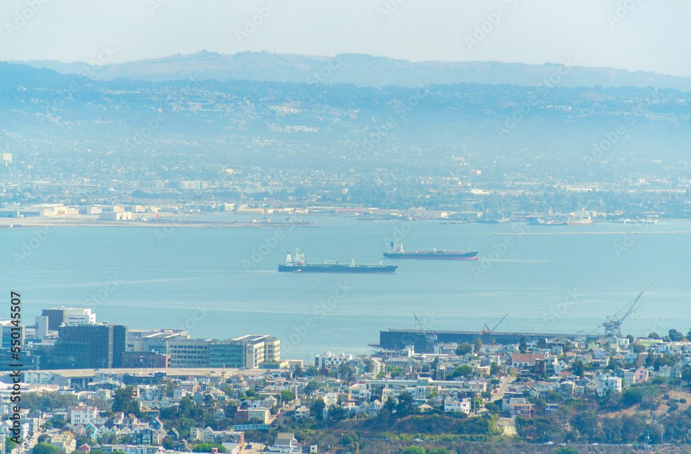 san francisco bay with boats and city midday