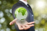 Business person hold a world Globe.