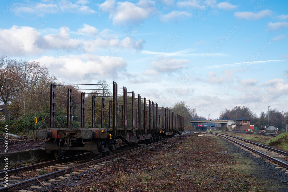 Empty railway freight wagons on the railway track.