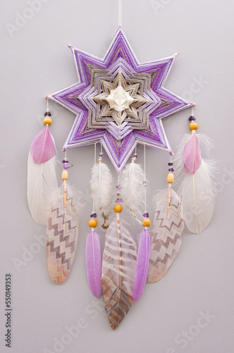 Esoteric woven mandala magical dreamcatcher  on grey background