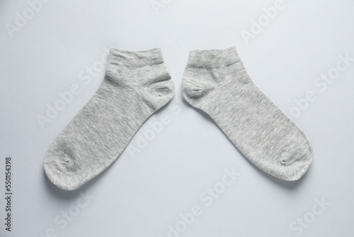 Pair of socks on light grey background, flat lay