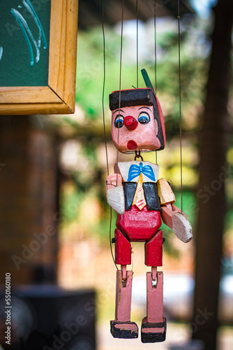 wooden doll with a doll photo