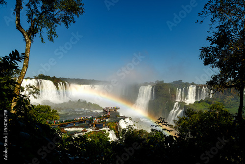 Tourists walk the platforms of the Iguazu Falls on the Brazilian side