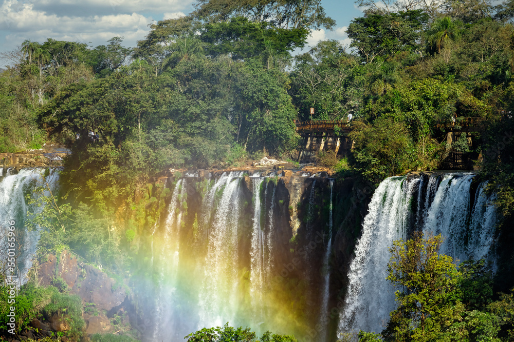 Tourists walk across a platform at Iguazú Falls Tourists walk across a platform at Iguazú Falls