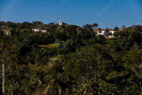 Colonial hotel looms in the jungle of Iguaçu National Park, Brazil photo