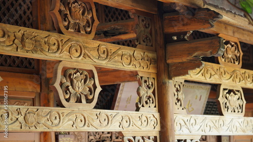The old wooden Chinese buildings with the sculptures on them 