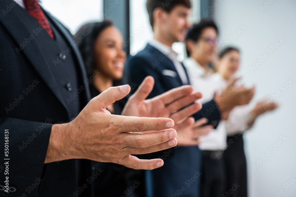 Close up hand of young businessman and businesswoman clapping together. Close up hand of young businessman and businesswoman clapping together.