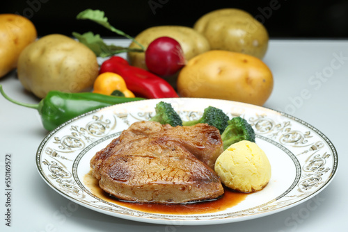 the steck set with vegetable in white plate photo