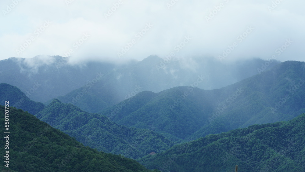 The raining mountains view with the foggy and misty raining droplets The raining mountains view with the foggy and misty raining droplets