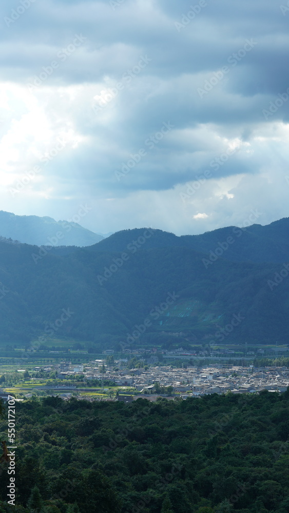 The beautiful mountains view with the cloudy sky and valley among them