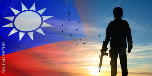 SIlhouette of soldier on background with national flag of Taiwan and sunset