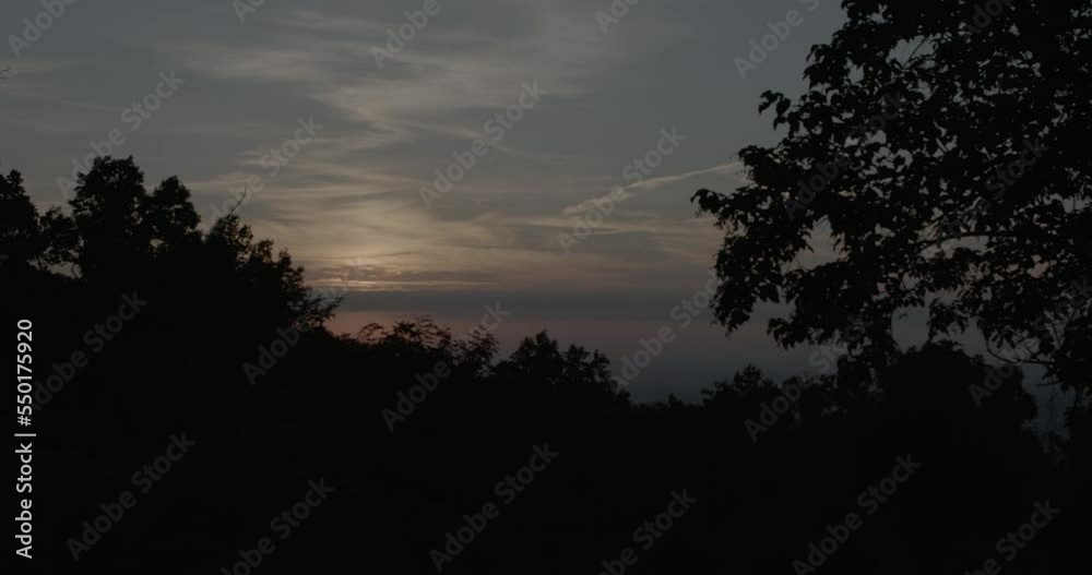 Time lapse of the sun rising over trees in mountainous Pennsylvania. Time lapse of the sun rising over trees in mountainous Pennsylvania.