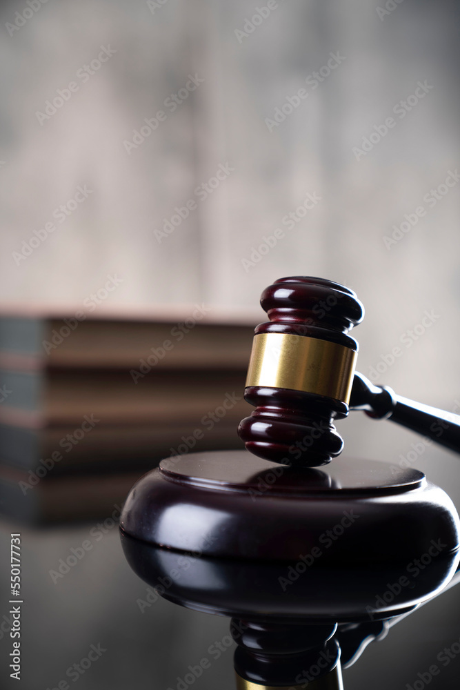 Law and justice concept. Gavel and scale on gray background Law and justice concept. Gavel and scale on gray background