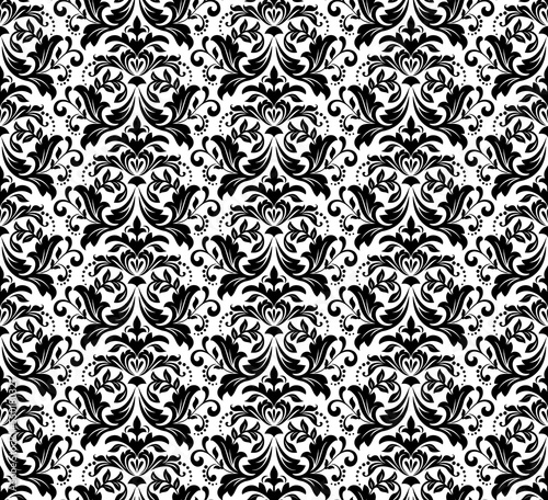 Wallpaper in the style of Baroque. Seamless vector background. White and black floral ornament. Graphic pattern for fabric, wallpaper, packaging. Ornate Damask flower ornament