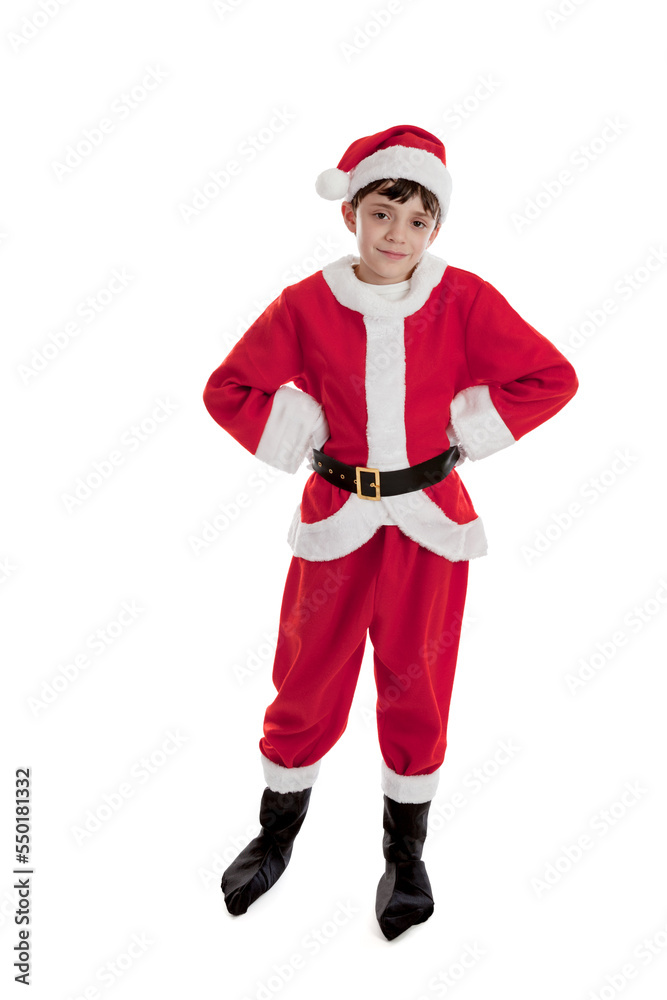 Full length portrait of a happy 10 year old boy dressed in a Santa suit and hat with hands on hips isolated on a white background Full length portrait of a happy 10 year old boy dressed in a Santa suit and hat with hands on hips isolated on a white background